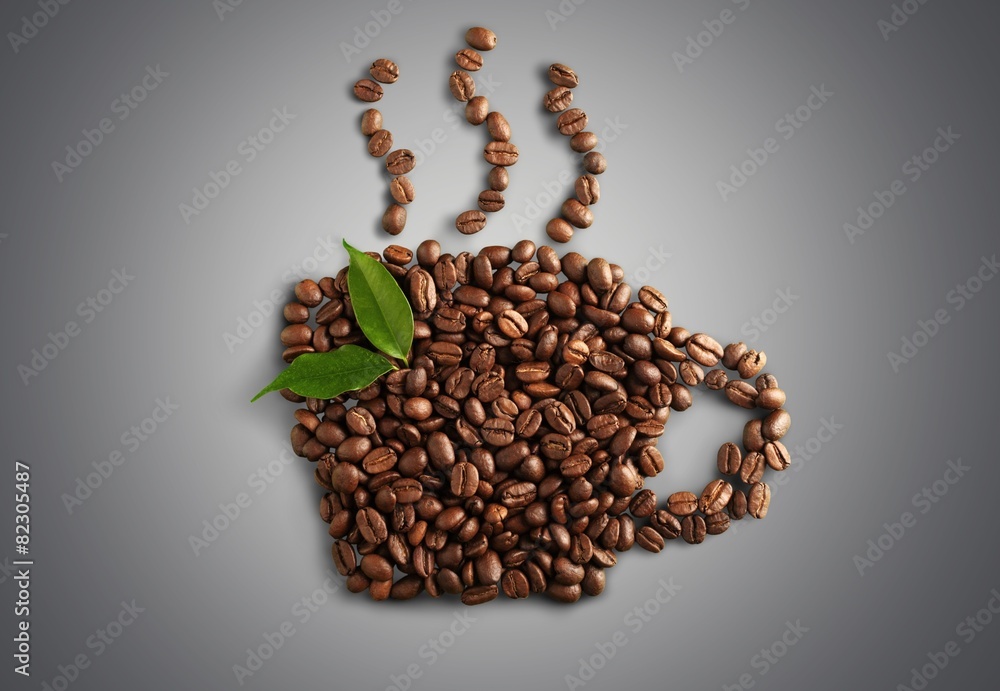 Background. Coffee beans with leaves isolated on white