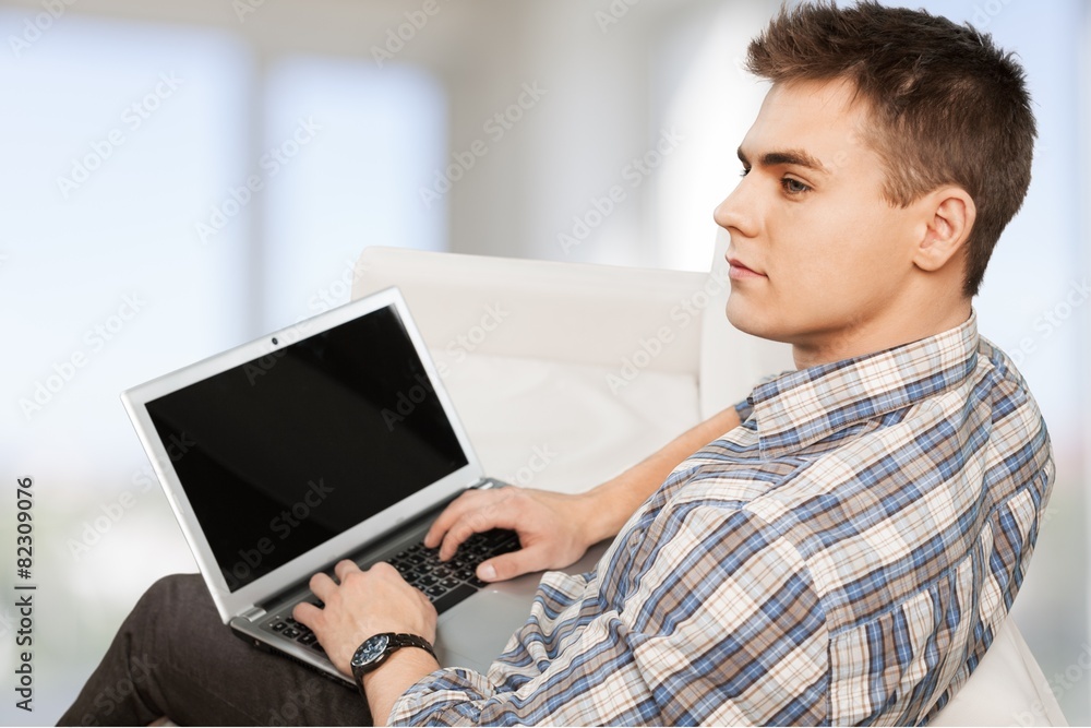 Laptop. Student in campus relaxing with laptop