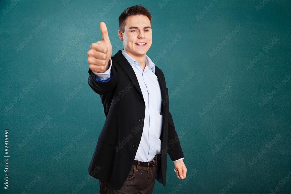 Academic. Young teacher near chalkboard in school classroom