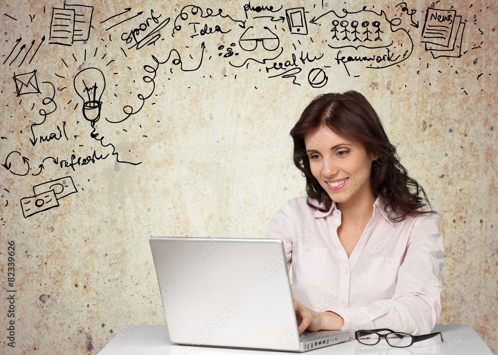 Laptop. Businesswoman posing near of laptop