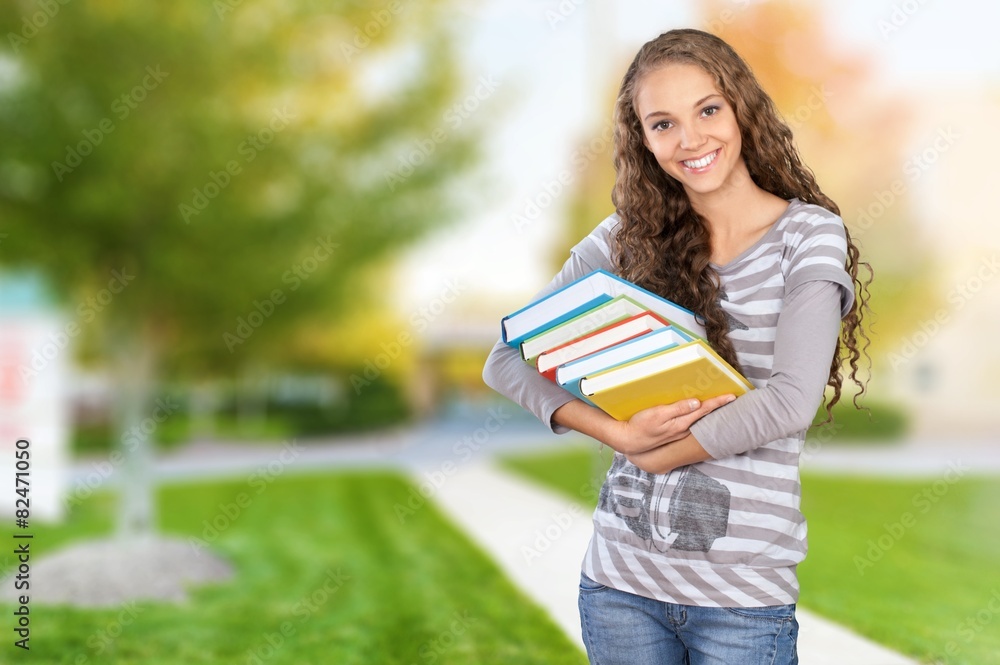 Student. Pretty Female Student Surrounded by Library Books