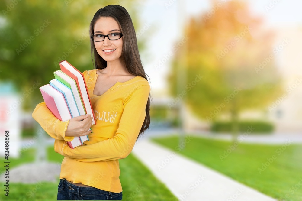 Student. Pretty Female Student Surrounded by Library Books