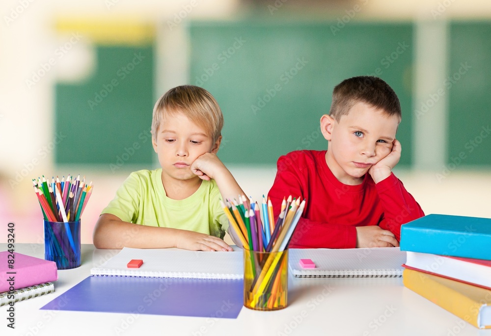 Child. Portrait of two diligent girls looking at camera at