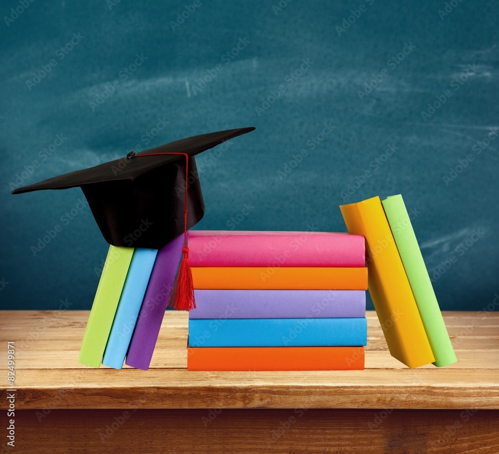 Graduation. Graduation cap on top of books