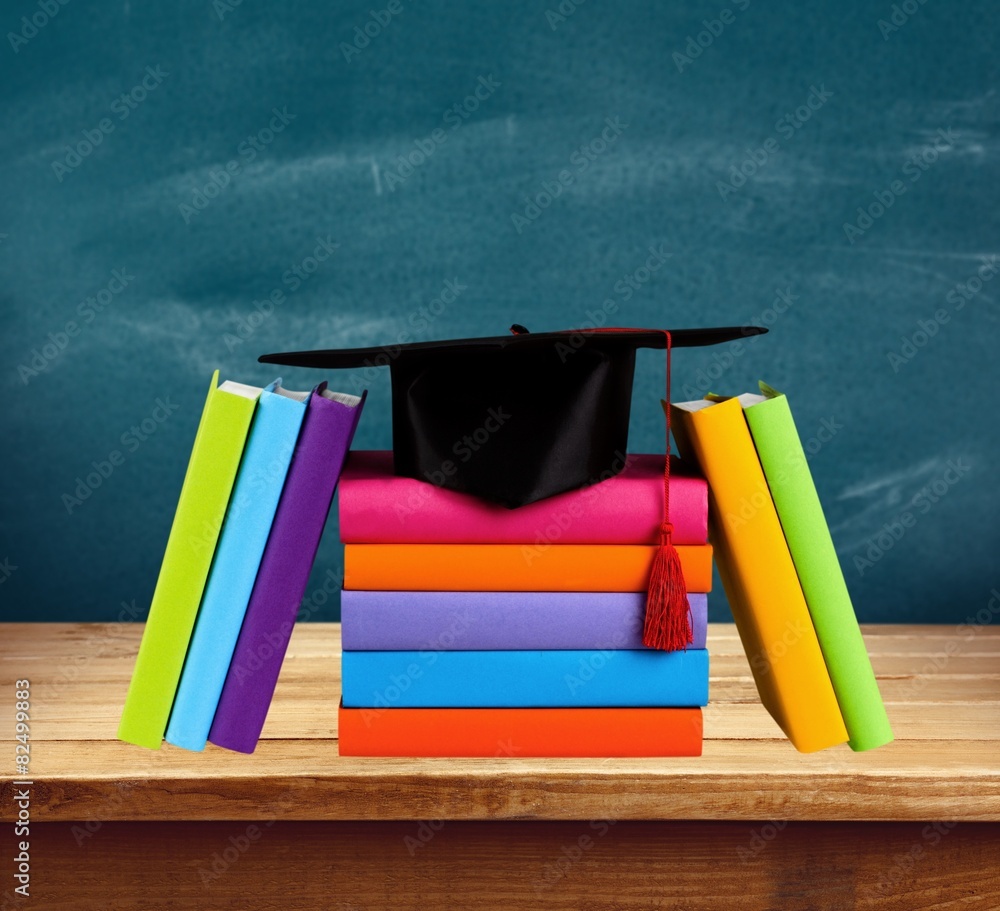 Graduation. Graduation cap on top of books