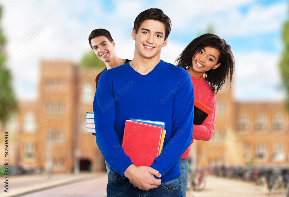 Students. Group of university students at the library smiling