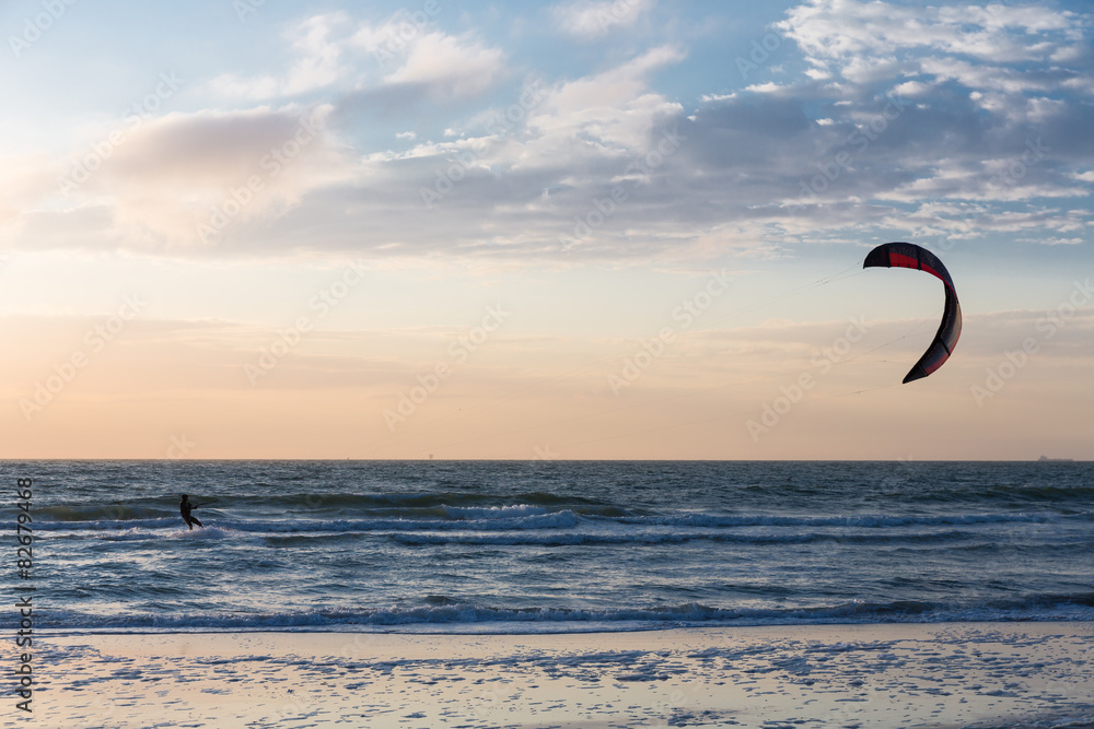 Kitesurfing in the evening along the Dutch coast