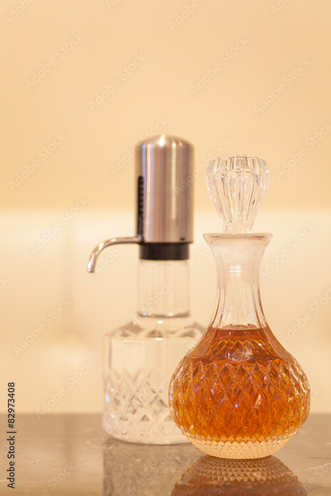 Bottle glass of whisky on wood table at bar