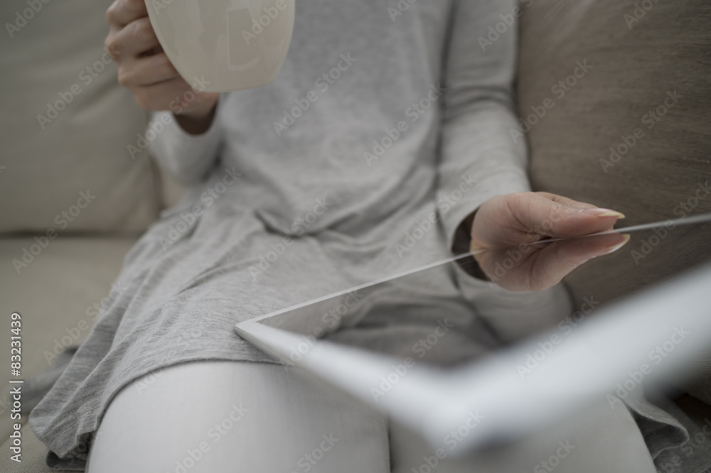 Women are reading the e-book while drinking coffee