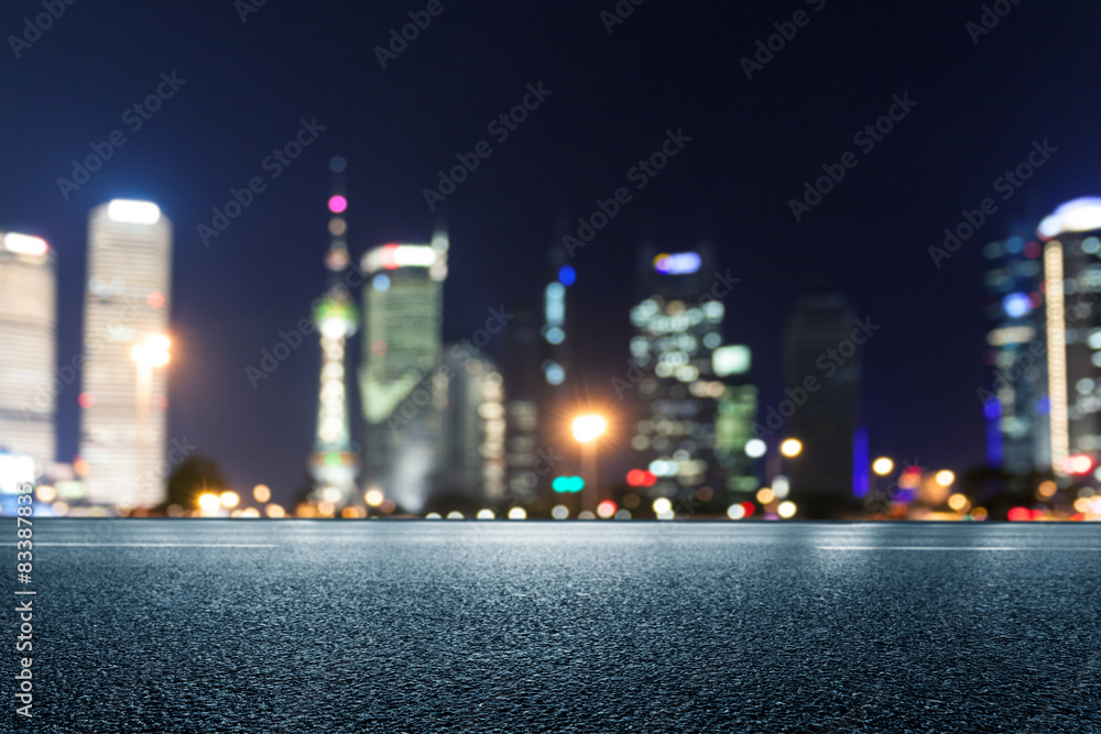 Empty floor with defocused modern buildings