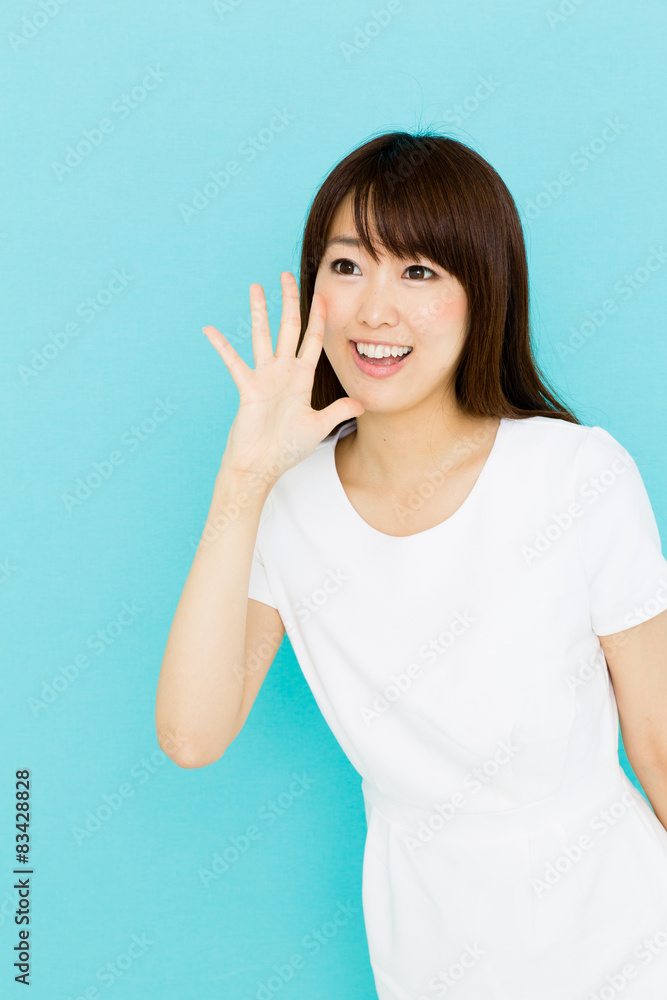 attractive asian nurse on blue background