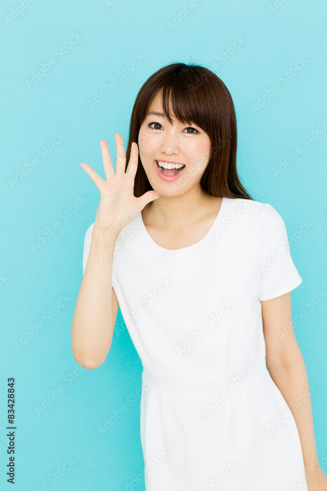 attractive asian nurse on blue background