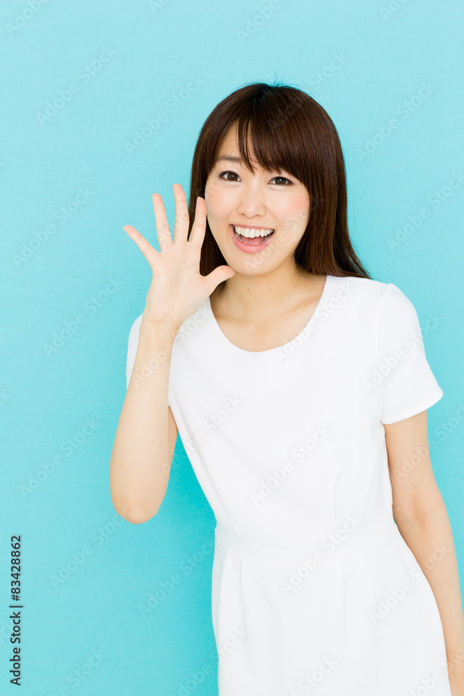 attractive asian nurse on blue background