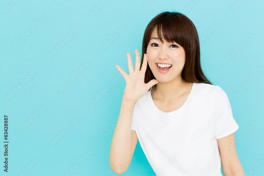 attractive asian nurse on blue background