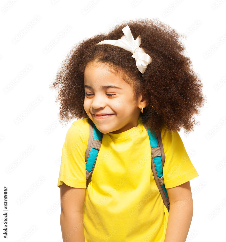 Shy African girl with white bow, closed eyes