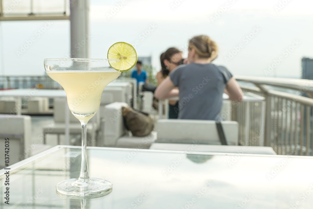 Margarita cocktail on table in rooftop bar