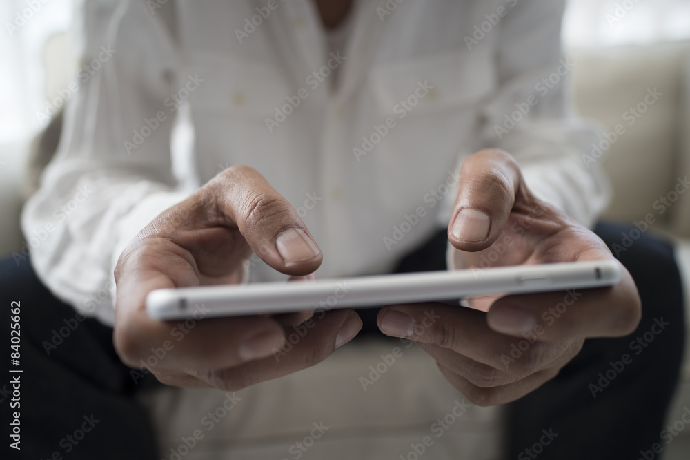 Businessmen are sending e-mail on the sofa