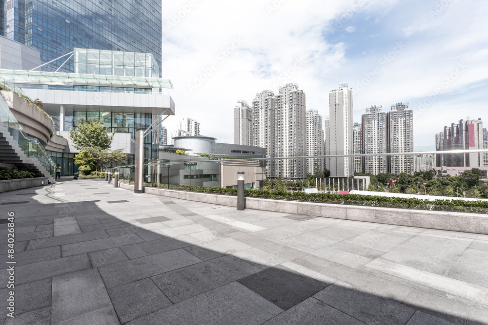 Empty road nearby office building