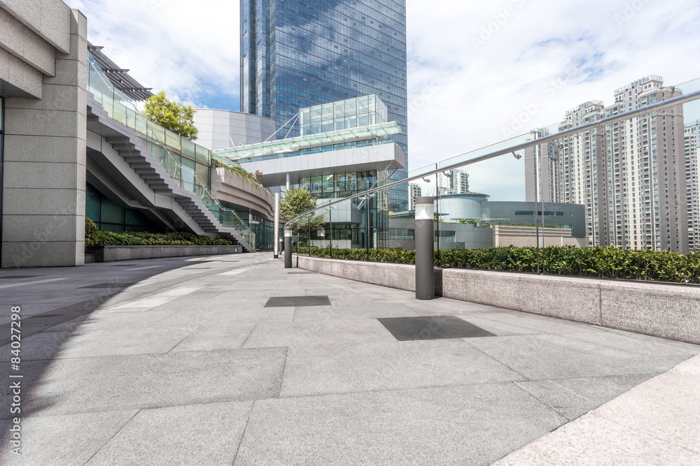 Empty road nearby office building