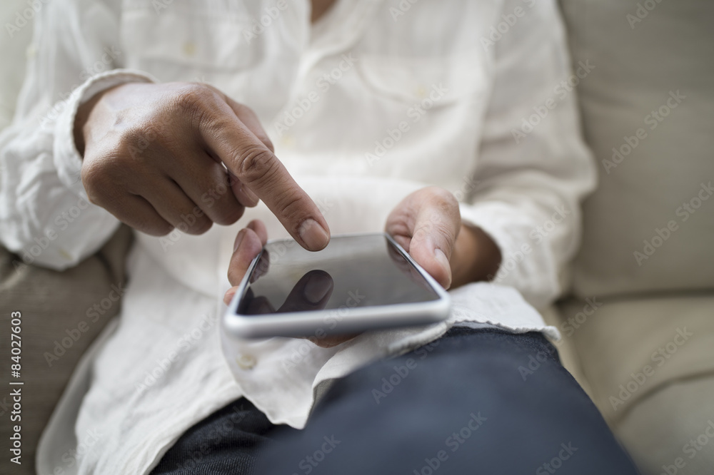 Men are sending mail on a couch at home