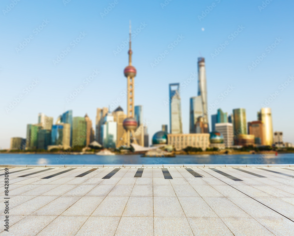 The empty square in front of the  fuzzy modern city, Shanghai, China