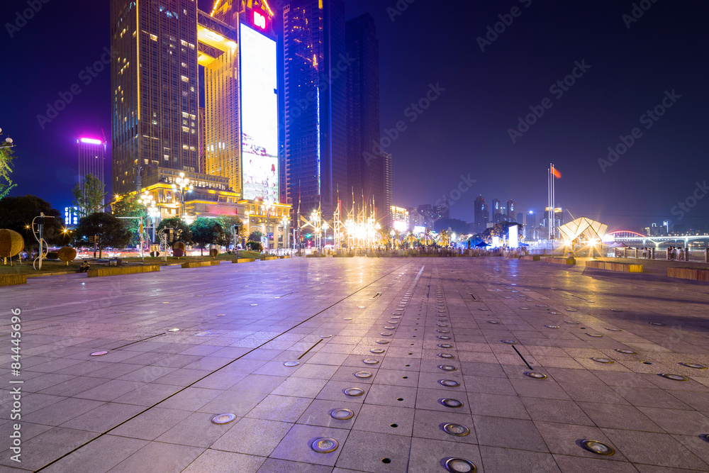 Empty floor and illuminated skyscraper