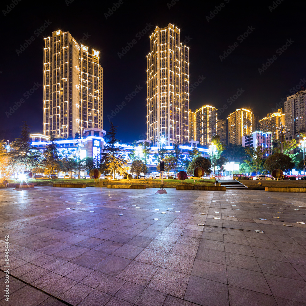 Empty floor and illuminated skyscraper