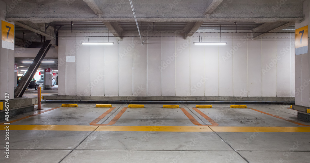 Empty space car park interior at night