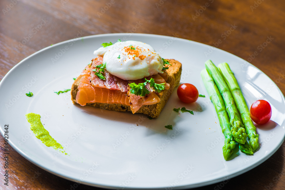 Sandwich with poached egg, parma ham and Salmon