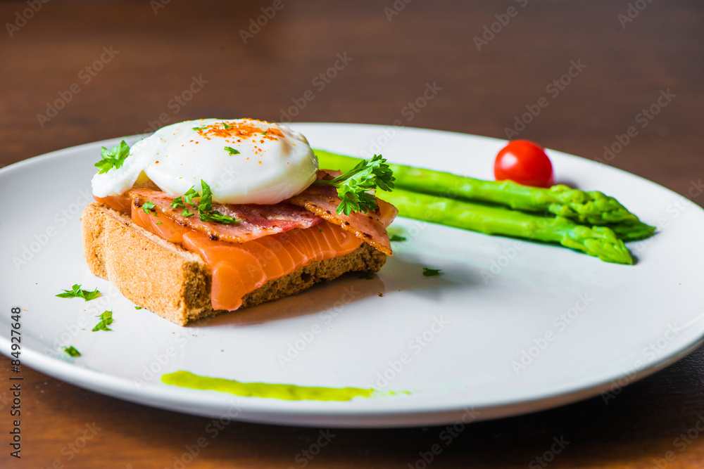 Sandwich with poached egg, parma ham and Salmon