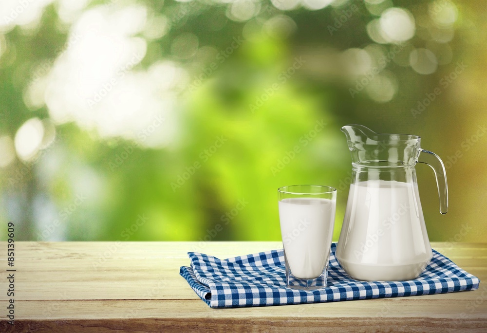 Milk, glass, tablecloth.