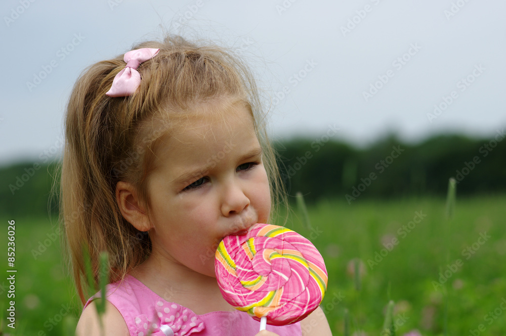  girl eating a lollipop