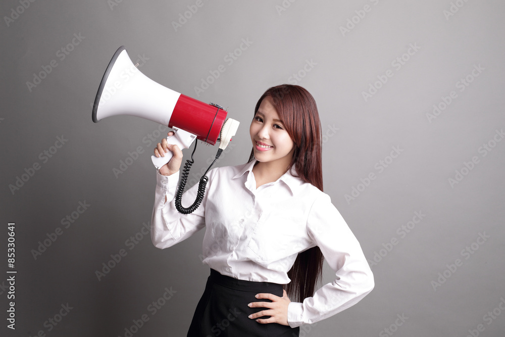 Business woman screaming with megaphone