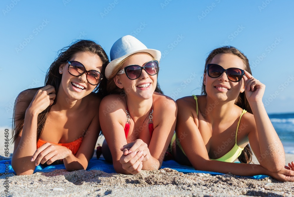 Women, swimwear, friends.