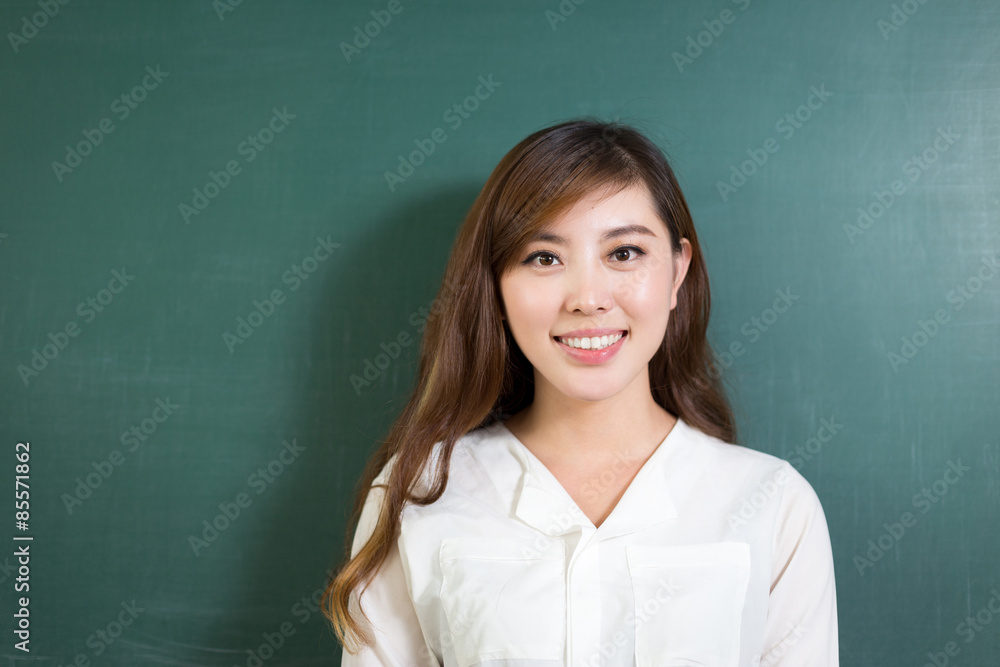 Asian beautiful woman standing in front of blackboard with gesture