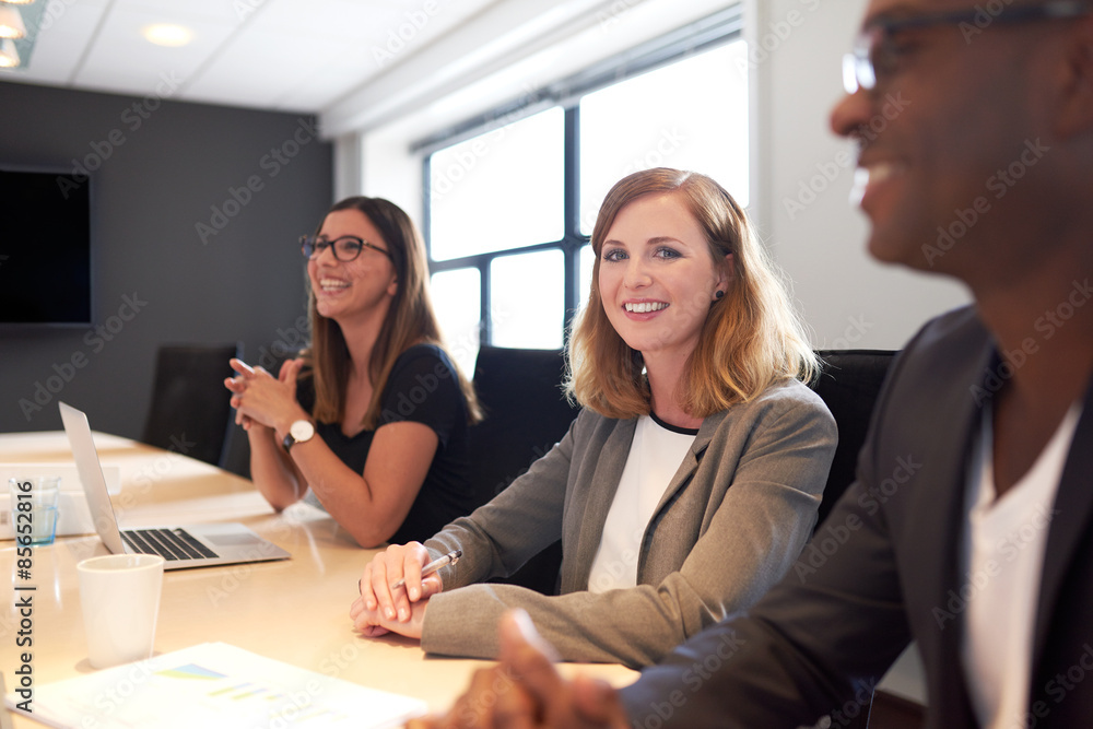 Young white female executive smiling at camera