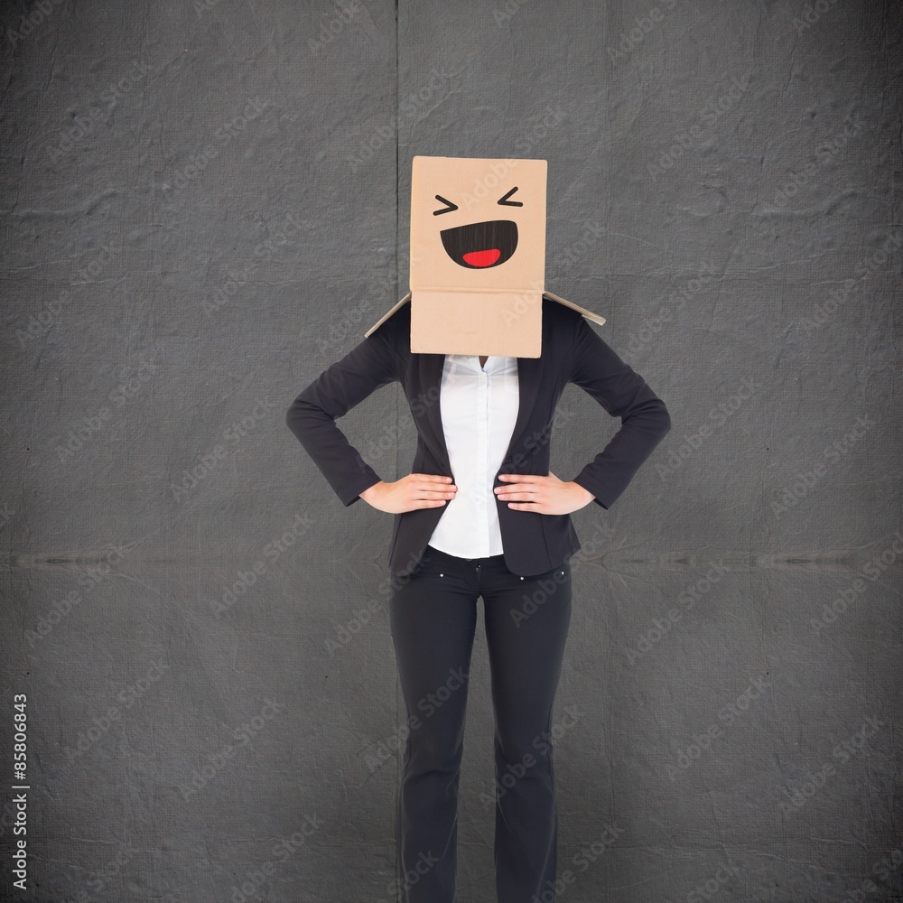 Composite image of businesswoman with box over head