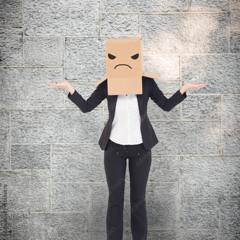 Composite image of businesswoman with box over head