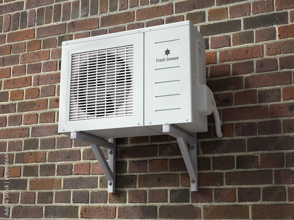 Air conditioner on a brick wall background