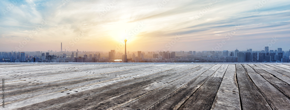 Panoramic skyline and buildings with empty wooden board