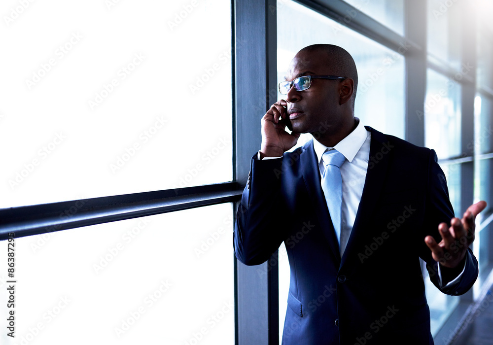 Businessman Talking on Phone Inside the Building