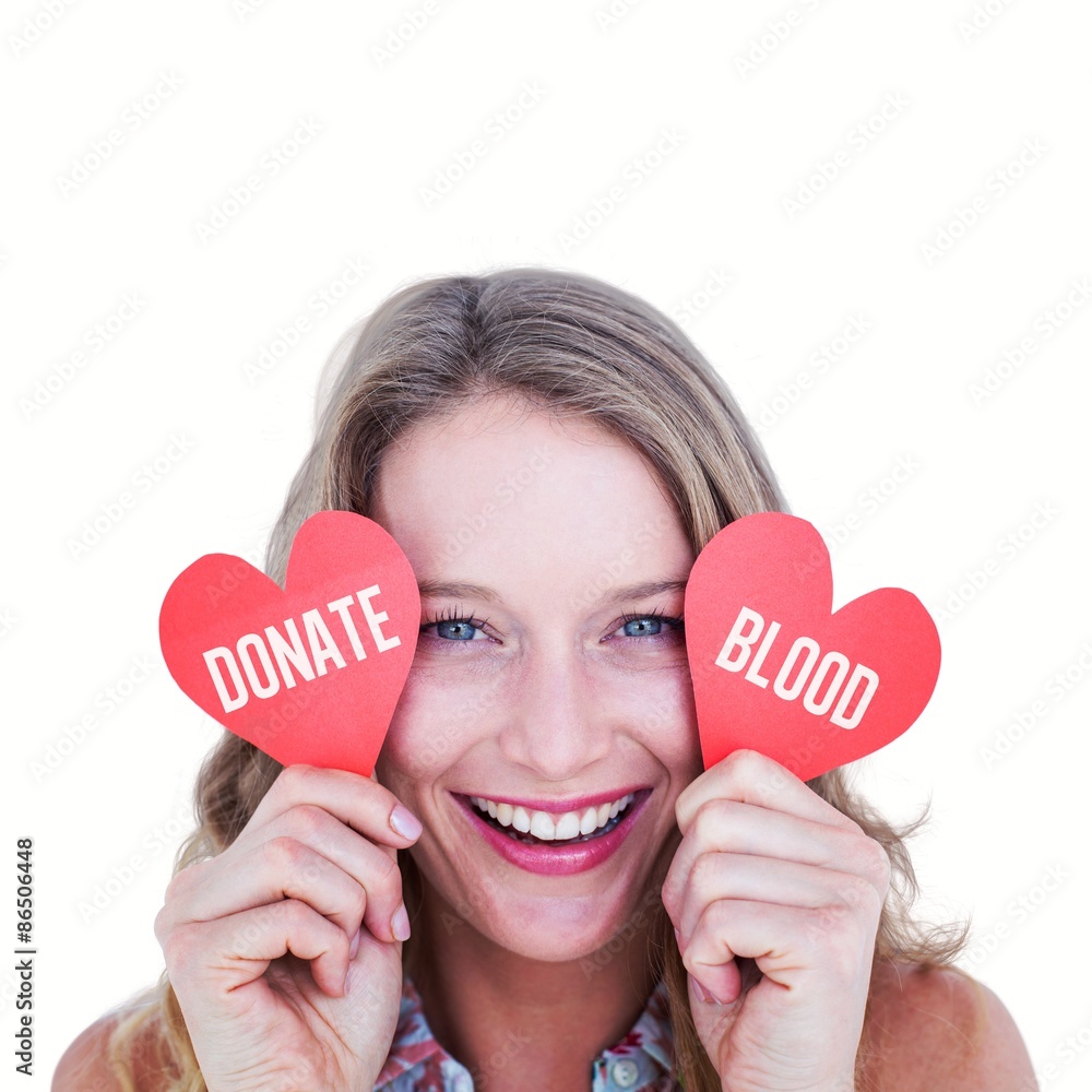 Composite image of woman holding heart cards 