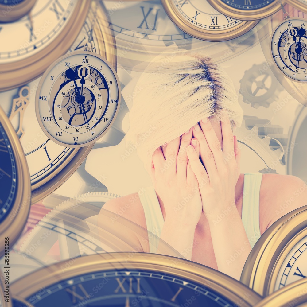 Composite image of sad blonde woman crying with head on hands 