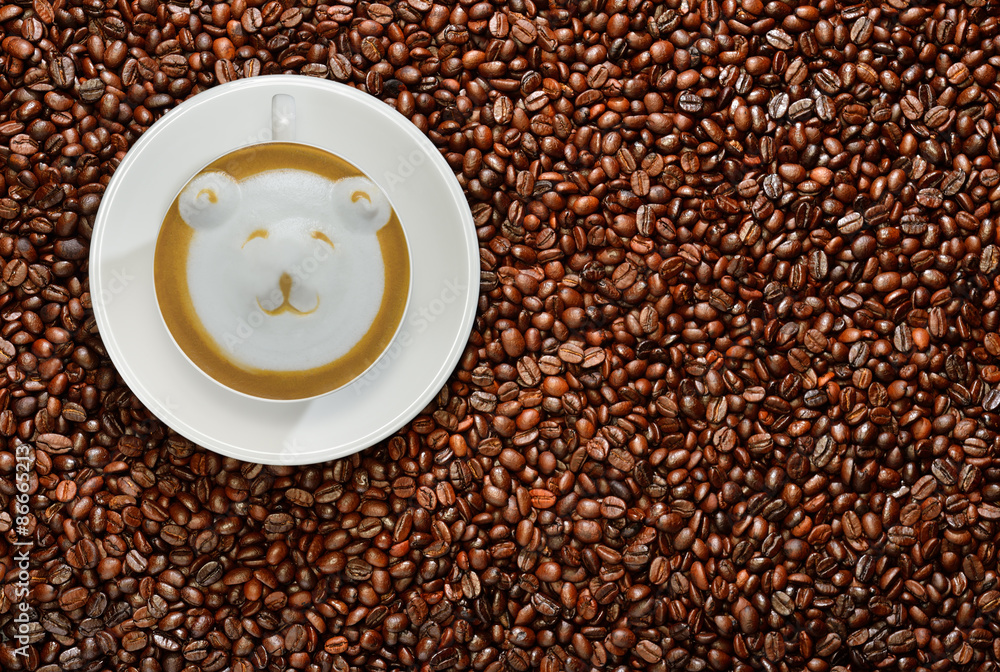 Cup of coffee latte on coffee beans background