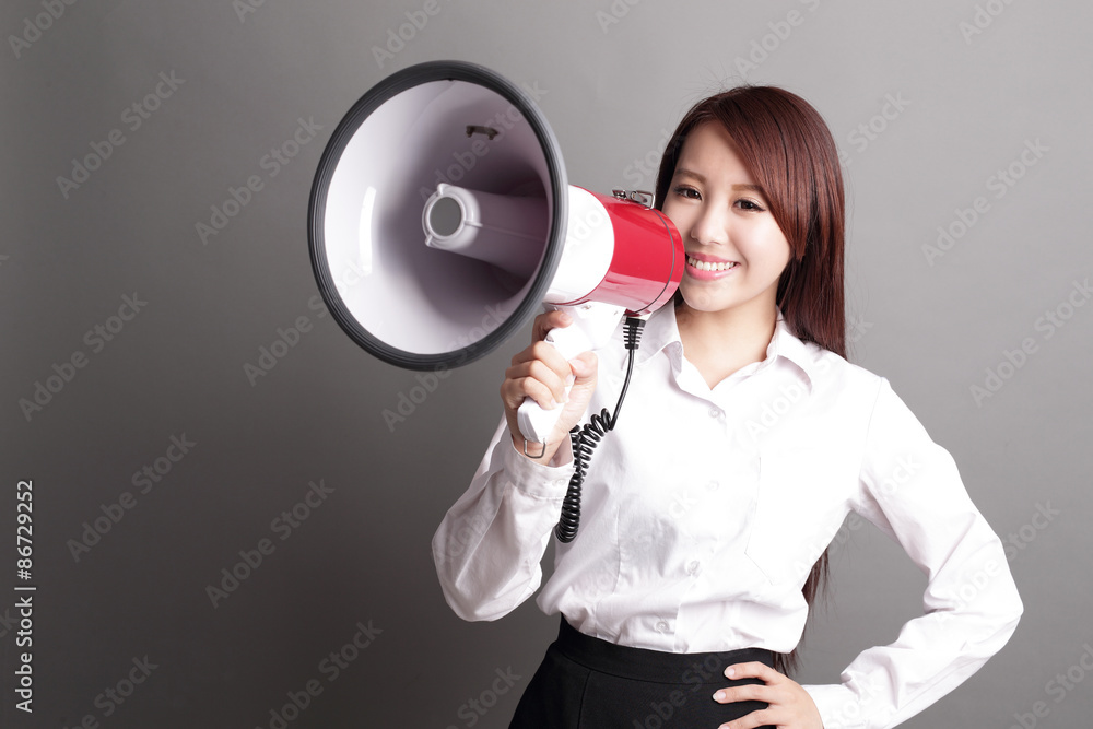 Business woman screaming with megaphone