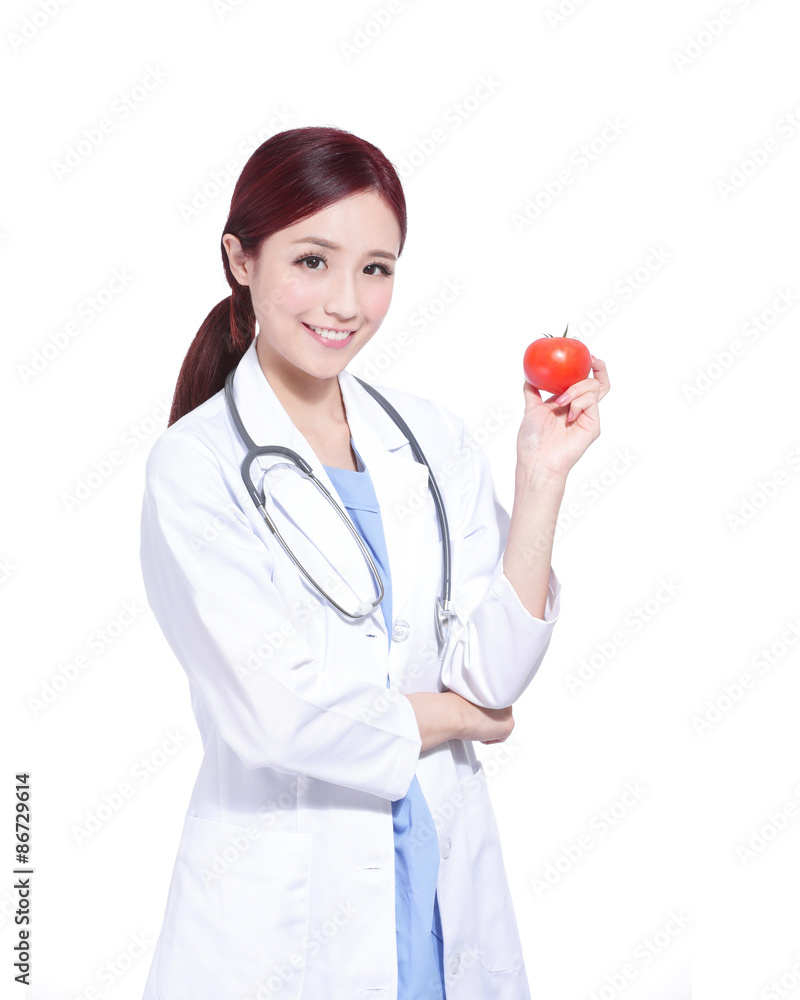 Smile woman doctor hold tomato