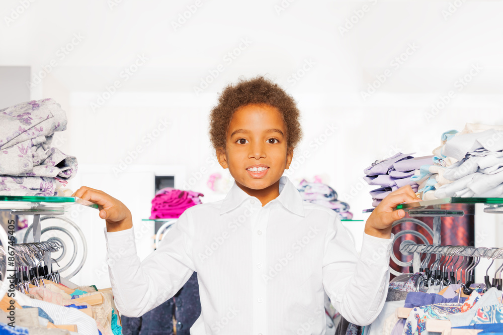 Close-up view of African boy in clothes store