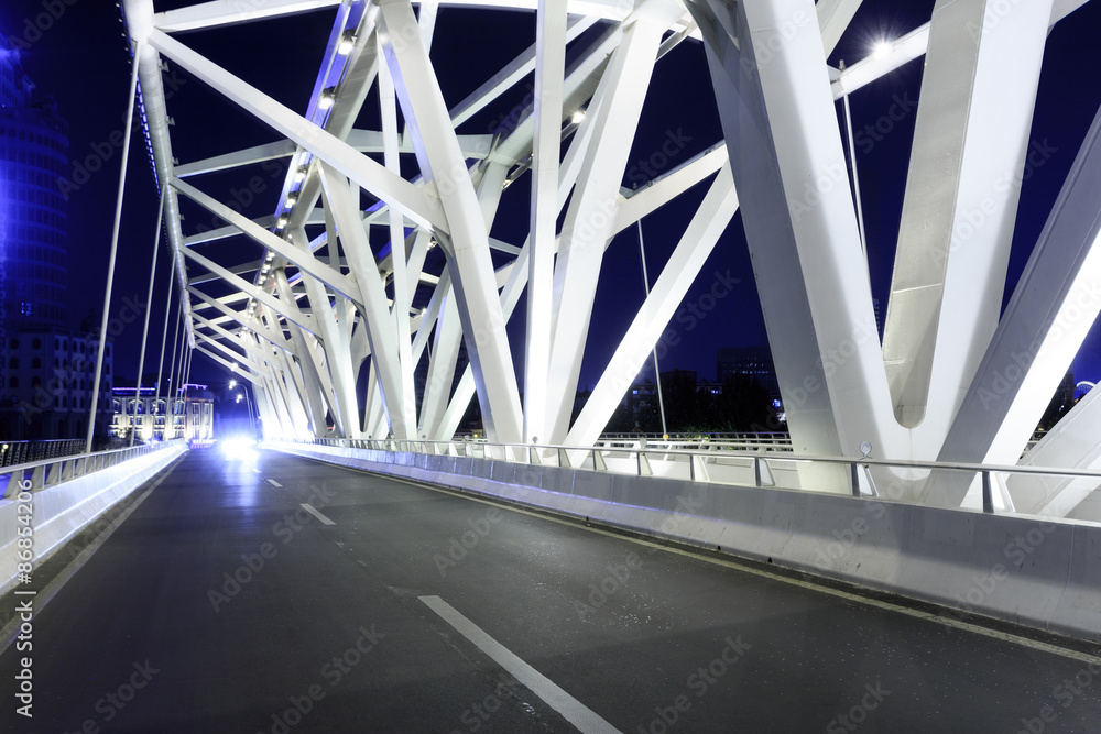 modern bridge with empty road floor at night