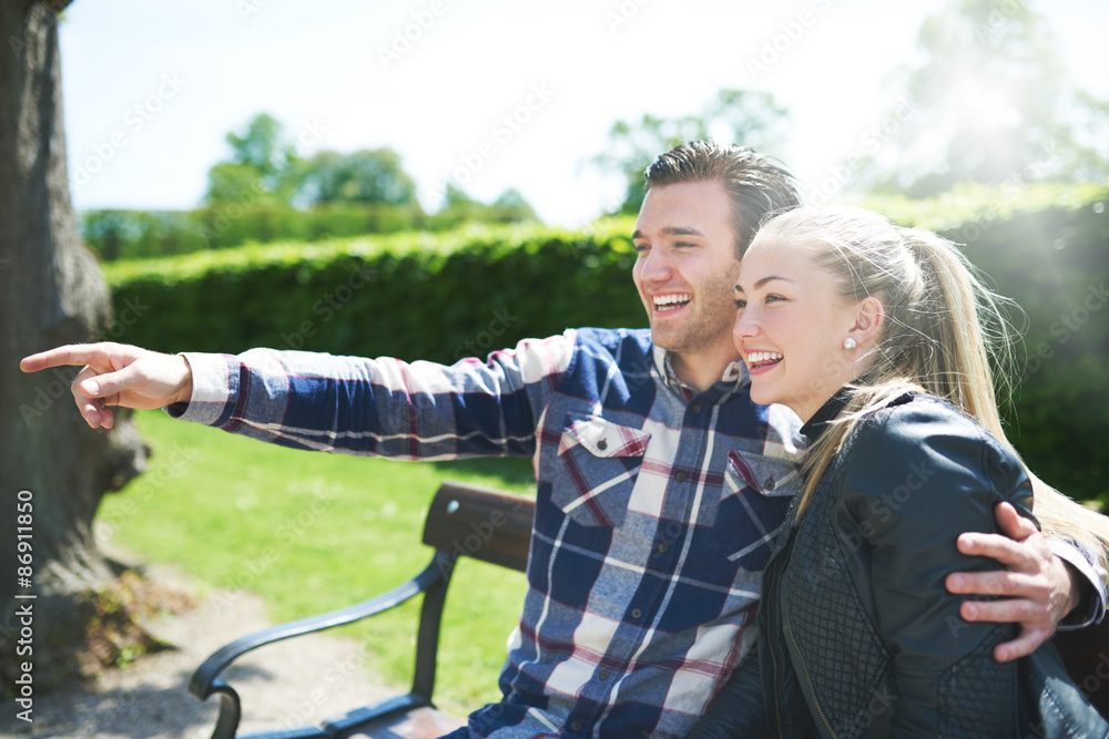 Laughing affectionate couple in the park