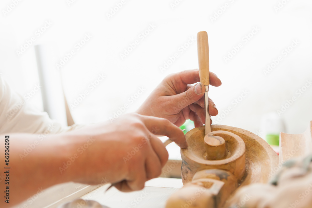 working hands of craftsman restorer